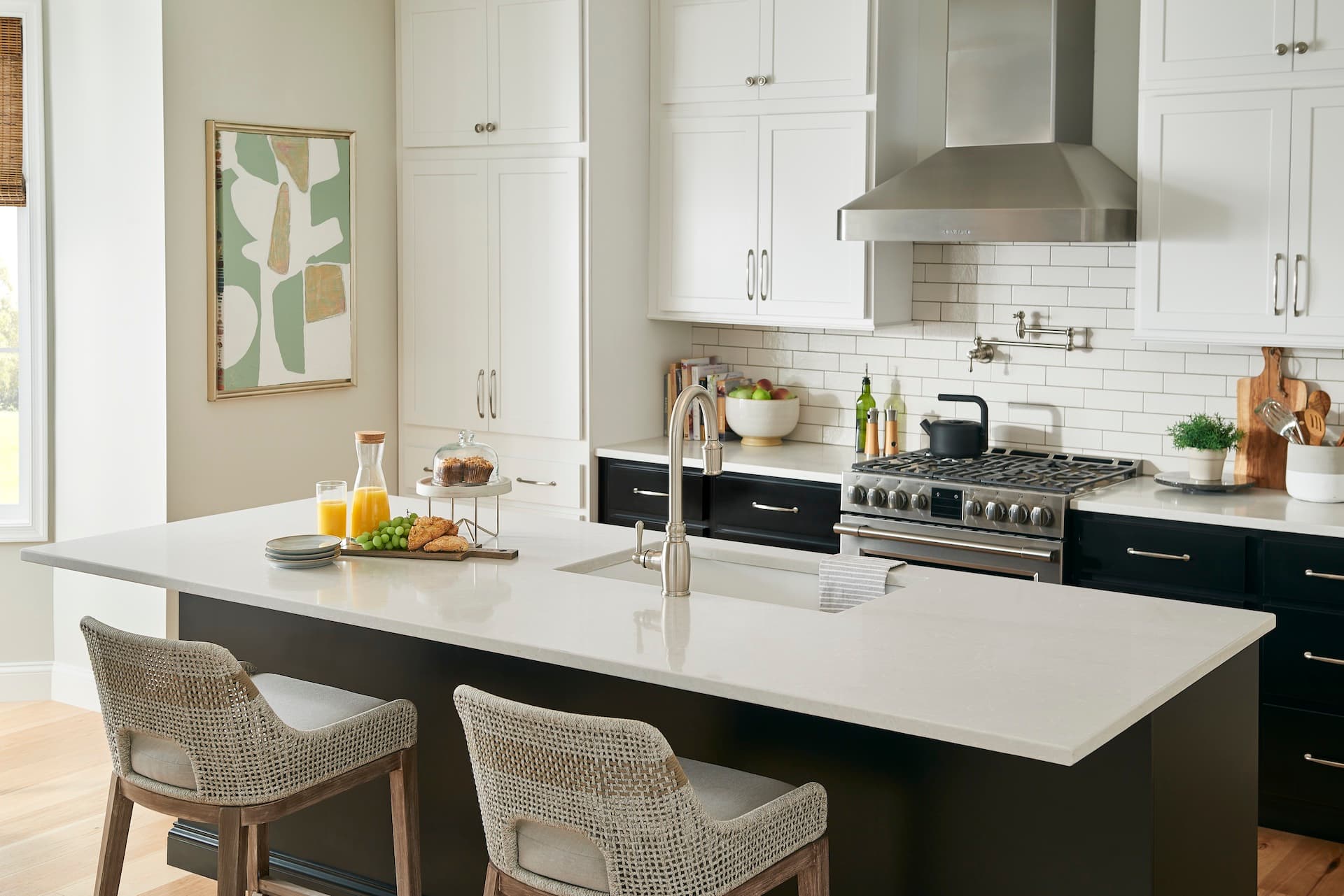Modern kitchen with white cabinets and professional range